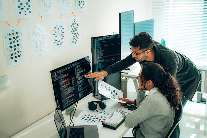 woman-and-man-looking-at-monitors.jpg